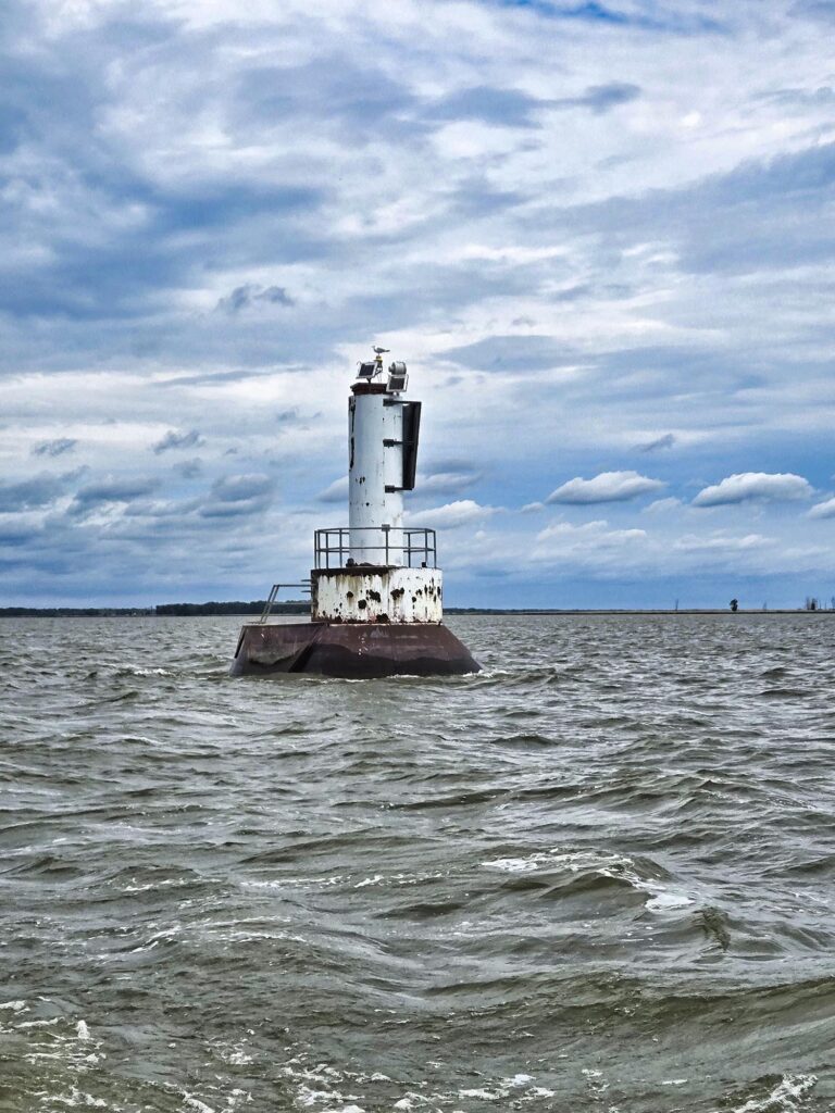 A navigation beacon surrounded by water